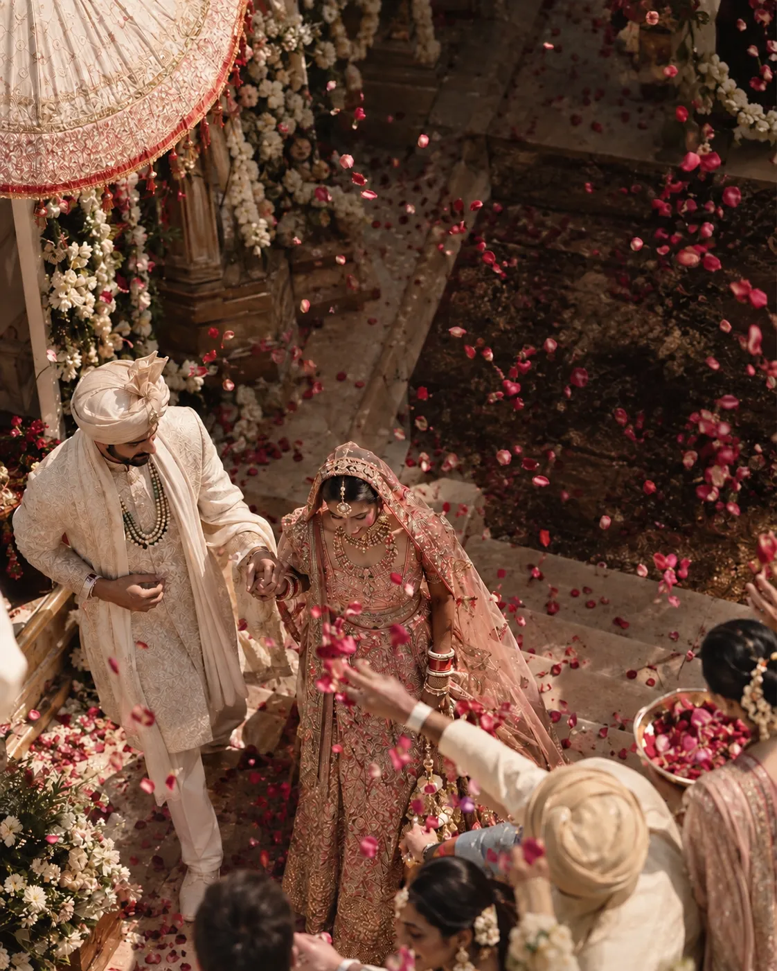 A petal shower as the couple leave the ceremony, at a wedding produced by WhiteTie Events